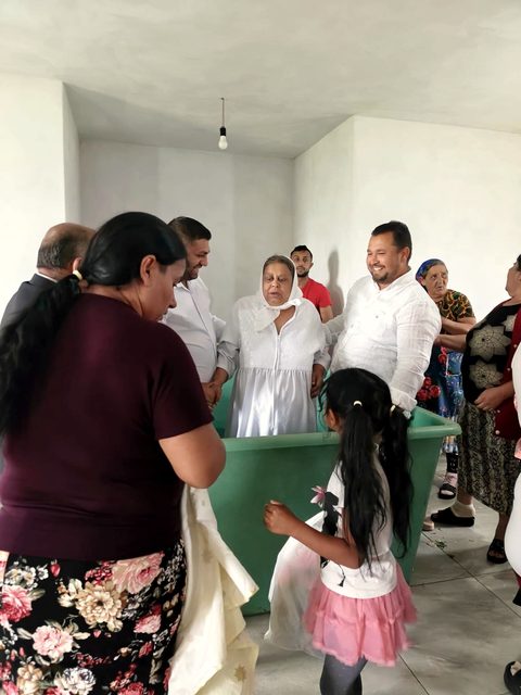 Baptism day in Lazareni, May 2026. Her story is told in the film “A Story of Transformation.”