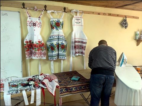 Aprons made in the sewing room; every sale is income for the women who make them