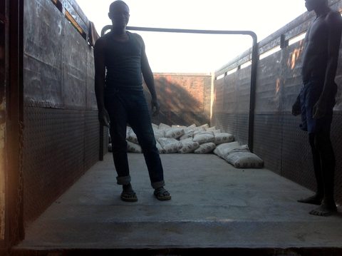 Loading the first truck for Timothy School, November 2015. Alex and Helen wrote from Juba that the trucks were ready but an acute fuel shortage held them up, and asked friends to pray for fuel and a safe road.
