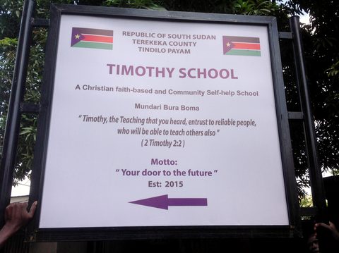 The Timothy School sign, made in Juba and carried to the site with the building materials, December 2015