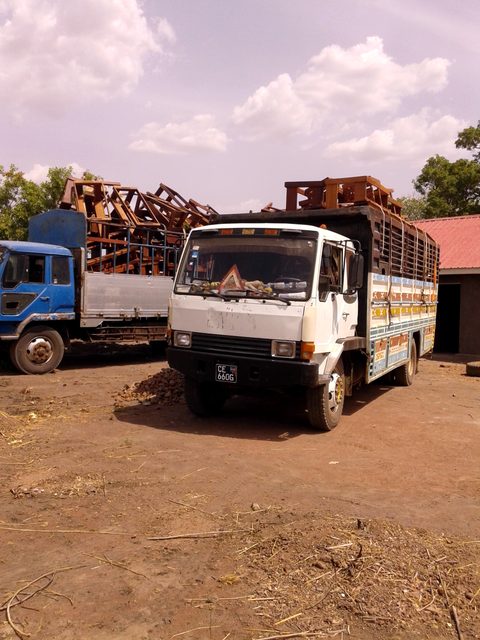 Trucks with the new desks and benches arrive in Mundari Bura, February 2016
