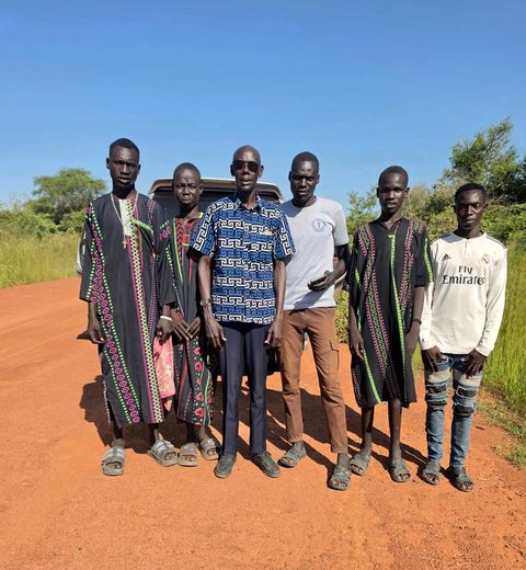 Timothy School’s grade 8 class with Dr. Alex on the way to Terekeka town to sit the Primary Certificate of Education exams, 2026. The students walked halfway, to where the seasonal road was no longer muddy, and Dr. Alex and his nephew drove them the rest of the way.